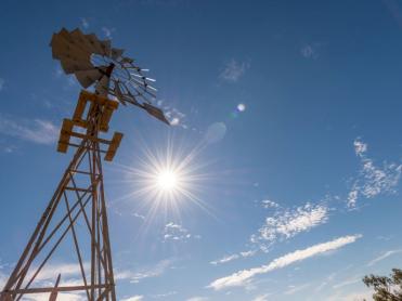 Windmill against blue sky